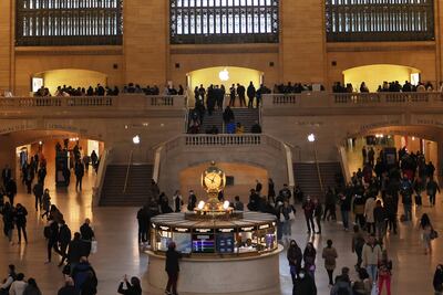 People visit the Apple store in Grand Central station on April 18 in New York. AFP