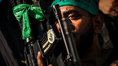 Fighters wearing Hamas paraphernalia show support for Palestinians killed in an Israeli assault on the Nour Shams refugee camp, West Bank. Photo: Los Angeles Times