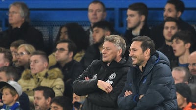 Manchester United's Norwegian manager Ole Gunnar Solskjaer, left, and his Chelsea counterpart Frank Lampard share a joke. AFP