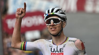 UAE Team Emirates-XRG rider Tadej Pogacar celebrates winning the 2025 Strade Bianche despite crashing earlier in the race. AFP