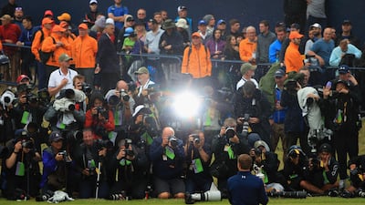 Jordan Spieth of the United States celebrates victory as he poses in front of photographers with the Claret Jug on the 18th green during the final round of the 146th Open Championship at Royal Birkdale on July 23, 2017 in Southport, England. Andrew Redington / Getty Images
