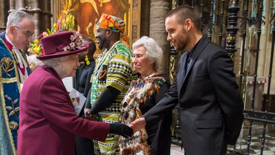 Queen Elizabeth meets British singer Liam Payne at Westminster Abbey. Getty