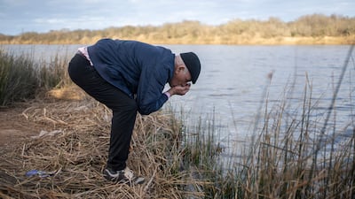 Mimoun Nadori tastes the water of the Moulouya River to check its salinity, in Nador, north of Morocco. Where the river once flowed from the mountains into the Mediterranean, it now sits stagnant, allowing seawater to creep inland and turning water from a source of life to a deadly poison. AP