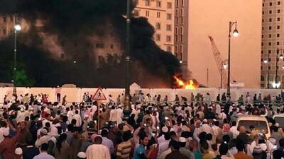 Worshippers gather after a suicide bomber detonated a device near the security headquarters of the Prophet's Mosque in Medina, Saudi Arabia, July 4, 2016. REUTERS/Handout
