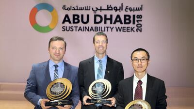 Left to right, Dr Ali Abshaev, Prof Eric Frew and Dr Lulin Xue with their awards at the UAE Research Programme for Rain Enhancement Science on Wednesday at Abu Dhabi National Exhibition Centre (Adnec). Chris Whiteoak / The National