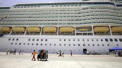 Passengers arrive at the cruise ship Mariner of the Seas at Mina Rashid. Jaime Puebla / The National