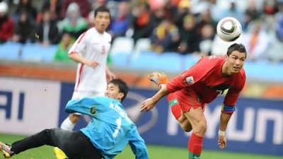 Cristiano Ronaldo, right, rounds Ri Myong-guk to score his first goal for Portugal in two years during their 7-0 thrashing of North Korea.
