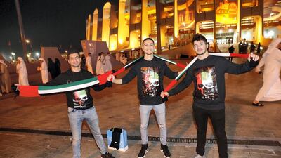 Hometown fans of the UAE have their flag scarves ready on the match against Bahrain at Zayed Sports City in Abu Dhabi. The game ended 0-0 draw. Antonie Robertson / The National
