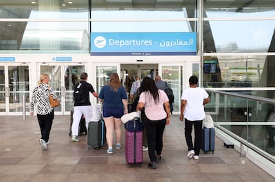 Passengers arrive at Terminal 3 in Dubai International Airport to catch their flights. Chris Whiteoak / The National