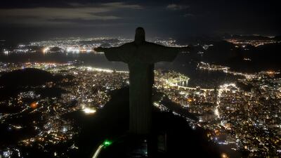 The Christ the Redeemer statue stands with its lights turned off during an hour of voluntary darkness for the global "Earth Hour" campaign in Rio de Janeiro, Brazil. AP