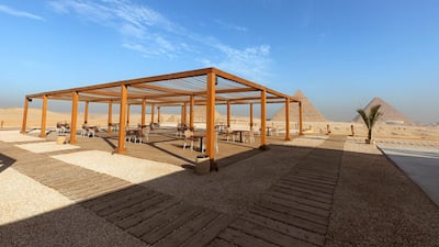 The light wooden structure and its subtle hues blend in with its storied surroundings