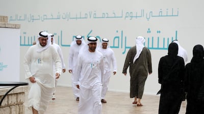 It starts to rain at the summit. Chris Whiteoak / The National