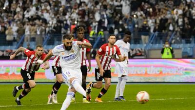 Real Madrid's Karim Benzema scores from a penalty kick during the Spanish Super Cup final soccer match between Real Madrid and Athletic Bilbao at King Fahd stadium in Riyadh, Saudi Arabia, Sunday, January 16, 2022. AP Photo
