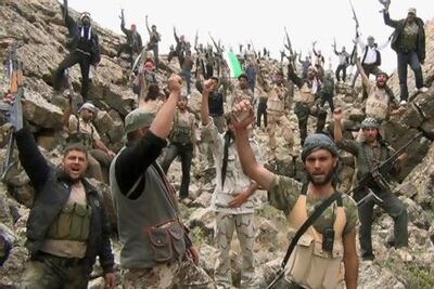 Free Syrian Army fighters shout 'Allahu Akbar' near Deraa in this still image taken from a video obtained by Reuters on Thursday.
