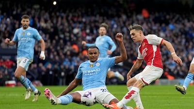 Arsenal's Leandro Trossard has a shot on goal past Manchester City's Manuel Akanji. PA