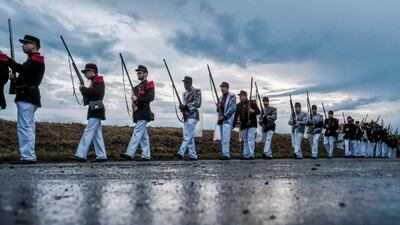 Many complete the journey by marching in a formal manner. Olivier Hoslet / EPA
