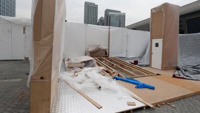 Workers get ready for the International Defence Exhibition and Conference (Idex) taking place in Abu Dhabi next week.