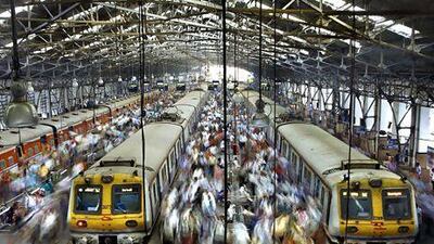 Commuters at Church Gate railway station in Mumbai. India will invest 14 trillion rupees by 2020 to expand and modernise its rail facilities. Rafiq Maqbool / AP Photo