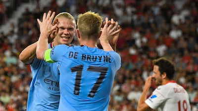 Haaland celebrates with teammate Kevin De Bruyne. EPA