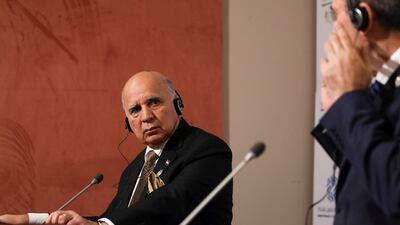 Iraqi Foreign Minister Fuad Hussein, left, and Jordanian counterpart Mr Safadi take part in a news conference. Reuters