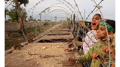 Palestinians take part in a protest near the border between the Gaza Strip and Egypt, against the construction of an underground barrier.