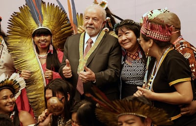 Brazilian then president-elect Luiz Inacio Lula da Silva poses with representatives of his country's indigenous people at Cop27 in Sharm El Sheikh, Egypt. AFP