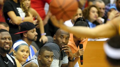 LA Lakers NBA player Kobe Bryant follows the game as he coaches a team made up of United Arab Emirates celebrities at the American University of Dubai September, 27, 2013. AFP