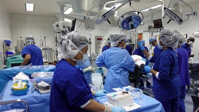 A surgical team from SKMC and Corniche Hospital during the procedure. Credit: SKMC