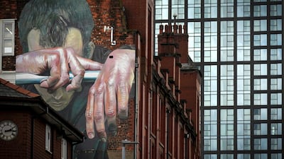 A mural on a wall in Manchester by German artist Case depicts the mental health issues which Covid restrictions spawned. Getty
