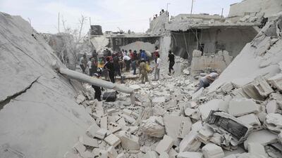 Rescuers search for survivors after a Syrian regime air strike on Kfar Ruma town in Idlib province on May 30, 2019. AFP