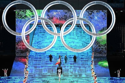 Lebanon's flag bearers Cesar Arnouk and Manon Ouaiss lead the delegation during the opening ceremony of the Beijing 2022 Winter Olympic Games. AFP