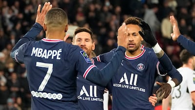Lionel Messi celebrates with Neymar and Kylian Mbappe after scoring PSG's fourth goal. AP