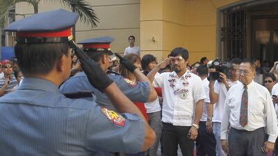 Manny Pacquiao appears in Manila last year for a "Hero's Welcome", meeting with Philippines President Benino Aquino III and getting greeted by an Honour Guard after defeating Timothy Bradley. Mike Young for The National / April 21, 2014