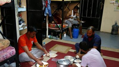 Asian workers have their lunch at their accommodation in Qadisiya labour camp, Saudi Arabia on August 17, 2016. Faisal Al Nasser/Reuters