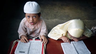 Bangladeshi Muslim children read the holy Koran at the Madrasa during the holy month of Ramadan in Dhaka. EPA