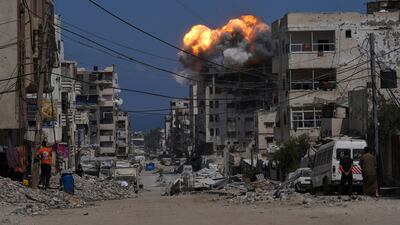 Smoke and flames erupt from an Israeli air strike in Gaza city. AP