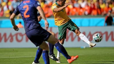 Tim Cahill shoots to score Australia's 1-1 equaliser on Wednesday in their match against Netherlands at the 2014 World Cup. Dean Mouhtaropoulos / Getty Images