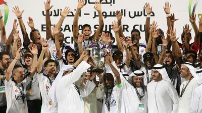 Al Ain players celebrate wining the Super Cup final match against Al Jazira. Jaime Puebla / The National
