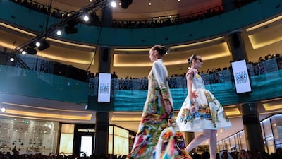 Models walk the runway during the Vogue Fashion Dubai Experience in 2014. Getty Images for Vogue & The Dubai Mall