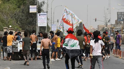 Iraqi protesters gather to block a street during an anti-government demonstration in Iraq's southern city of Nasiriyah in Dhi Qar province. AFP