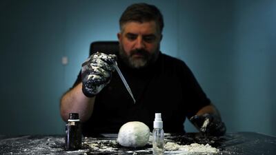 Omar Sartawi, a Jordanian chef, recreates an ancient statue found in Jordan using a famous local product - Jameed (dried goat's milk used in the country's national dish), at his workshop in Amman, Jordan. REUTERS