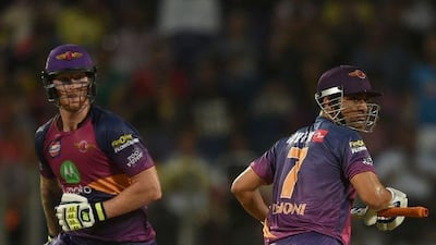 Rising Pune Supergiant's Ben Stokes, left, and MS Dhoni run between the wickets during their match against Gujarat Lions at The Maharashtra Cricket Association Stadium in Pune on May 1, 2017. Indranil Mukherjee / AFP