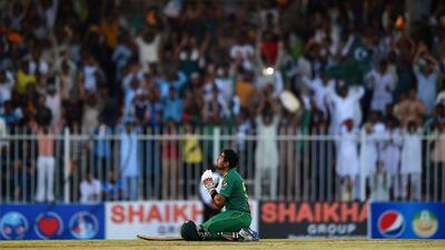 Babar Azam of Pakistan celebrates scoring 100 during the first ODI against West Indies in Sharjah on Friday. Tom Dulat / Getty Images / September 30, 2016