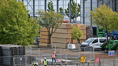 Construction workers prepare the site of the Cop26 climate summit in Glasgow, Scotland, where world leaders will gather for one of the biggest global meetings dedicated to tackling the climate crisis. Getty Images