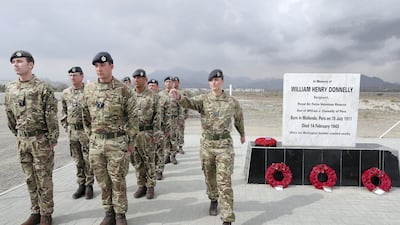 Representatives from the UK services attend a 2018 memorial service for Donnelly. Pawan Singh / The National