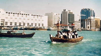 An abra on Dubai Creek in the 1980s with Deira in the background.