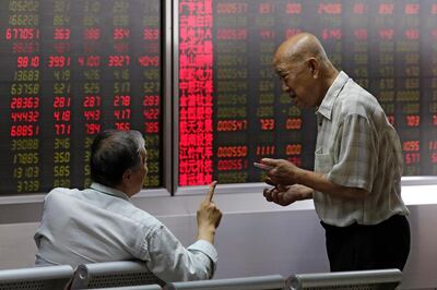 Stock prices at a brokerage house in Beijing. AP