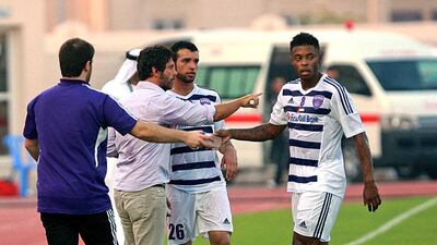 In his first appearance as Al Ain manager, Quique Sanchez Flores, second from the left, was cool and collected as his new Garden City squad responded with a comfortable victory at Al Shaab on Friday night. Satish Kumar / The National