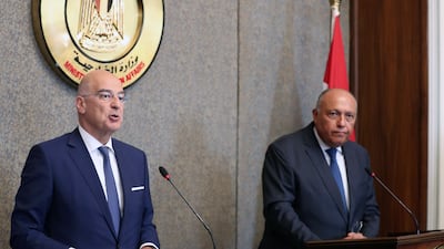 Greek Foreign Minister Nikos Dendias, left, and Egyptian Foreign Minister Sameh Shoukry at a press conference in Cairo on October 9. EPA