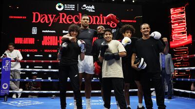 Anthony Joshua poses for a photo with children from a Riyadh boxing club. Getty
